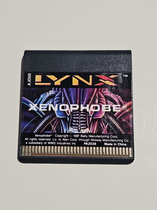 Xenophobe - Atari Lynx Vintage Handheld Rare Collectors Tested Working cap/hat front (Image 1) — Second-Hand
