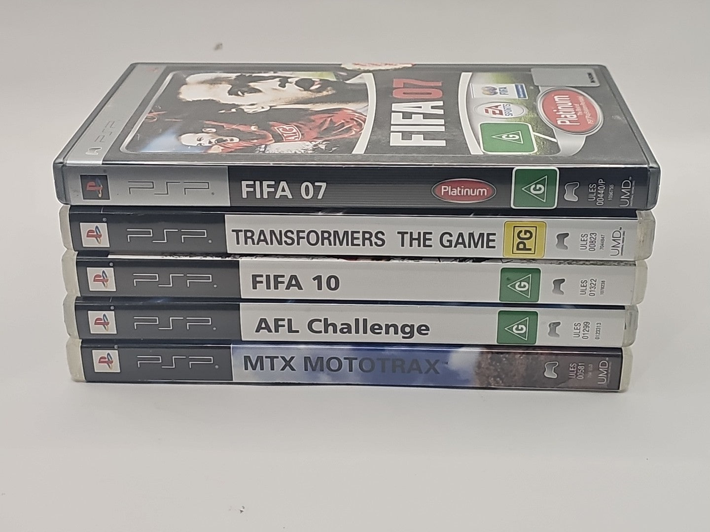 Sony PSP 5 Game Mixed Bundle PlayStation Portable Fifa,Transformers,AFL,MTX PSP cover photo (Image 1) — Second-Hand