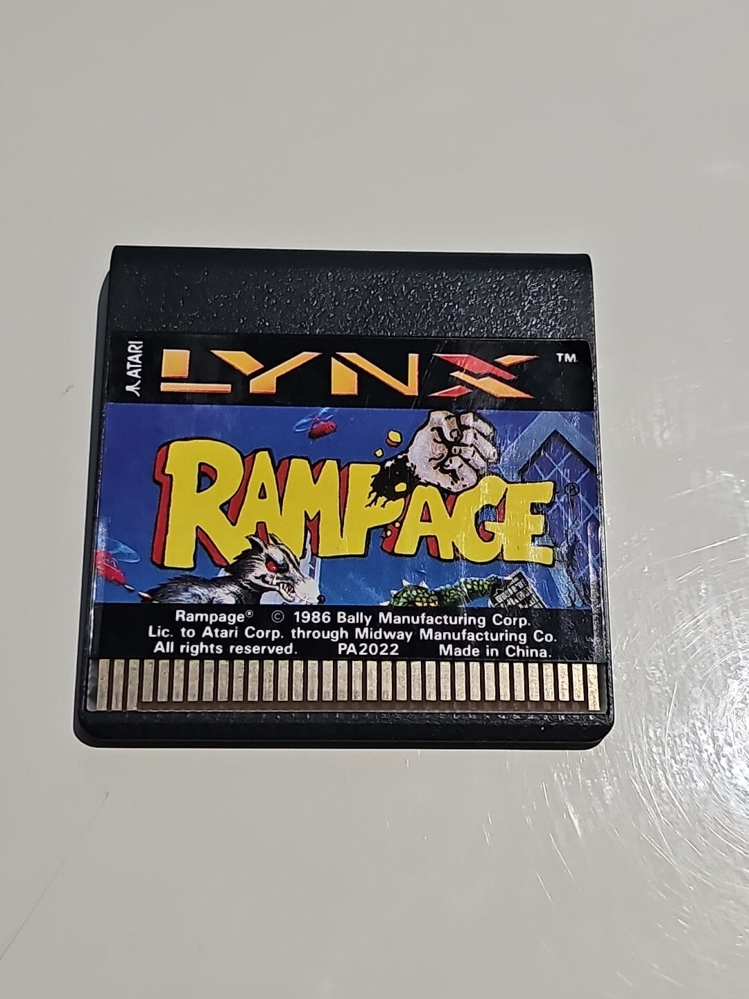 Rampage Atari Lynx Cartridge PAL - Fast Post cap/hat front (Image 1) — Second-Hand