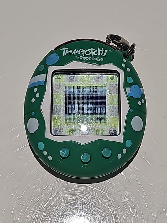 Tamagotchi Green Connection V2 (2004) – Bandai Virtual Pet – Working cap/hat front (Image 1) — Second-Hand