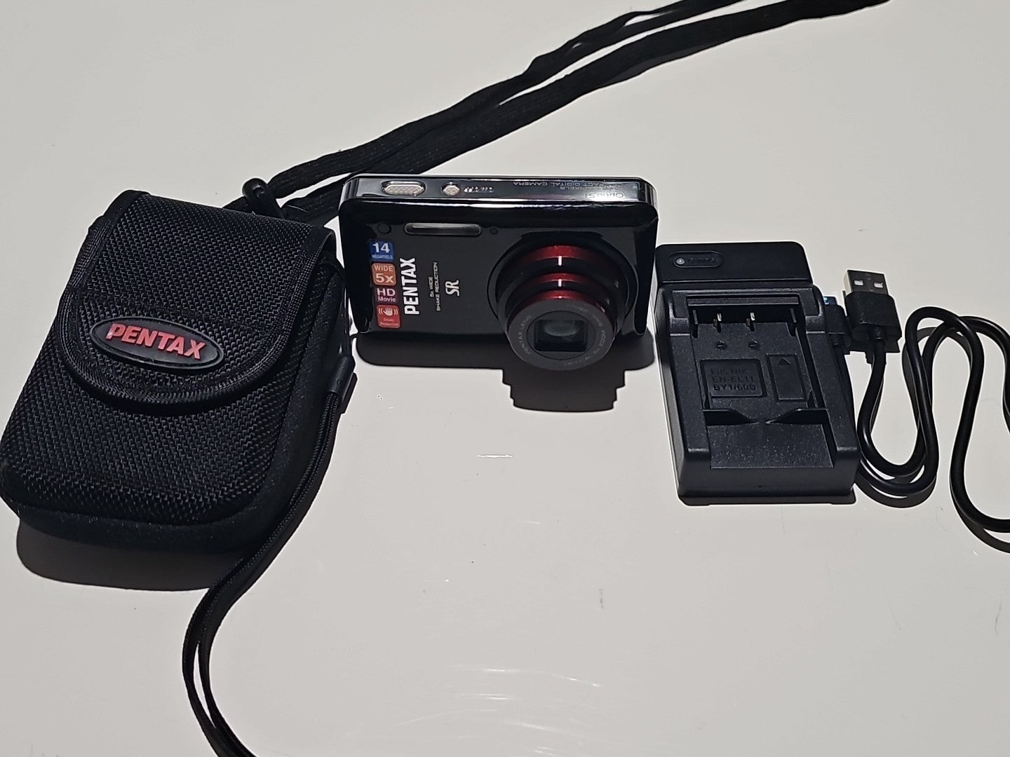 Pentax Digital Camera Optio S1 14MP 5X Wide, HD Shake Reduct. Black Tested device front (Image 1) — Second-Hand