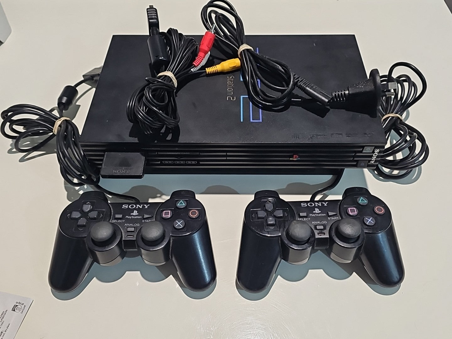 Sony Playstation 2 PS2 Fat Console With 2 Controllers Plus Cables And Memory controller front (Image 1) — Second-Hand